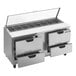 A Beverage-Air stainless steel refrigerated sandwich prep table with drawers and clear lids.