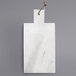 An American Atelier white marble cutting and serving board with a leather handle.