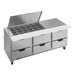 A large stainless steel counter with clear lid drawers.