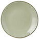 A Tuxton Artisan china plate with a brown rim.