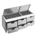 A Beverage-Air stainless steel refrigerated sandwich prep table with six drawers on a silver counter.