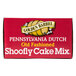 A red Golden Barrel box of Shoofly Cake Mix with white and yellow text on a bakery counter.