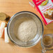 A bowl of flour and a box of Golden Barrel Shoofly Cake Mix on a counter.