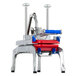 A Prince Castle Saber King fruit and vegetable cutting machine with red and blue handles.