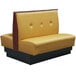 An American Tables & Seating yellow and brown fully upholstered booth with black legs.