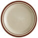A Libbey narrow rim stoneware plate with brown stripes on it.