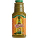 A 64 fl. oz. bottle of Cholula Green Pepper Hot Sauce on a table with a label.