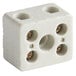 A white block with four holes in it.