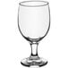 An Acopa clear glass wine goblet with a small base.