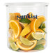 A Sunkist glass food storage container filled with lemon, lime, and orange slices.