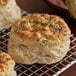 A close-up of three biscuits with Regal Thyme Leaves on top.