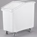 A white Cambro ingredient storage bin with a lid and wheels.