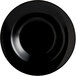 An Arcoroc black opal glass pasta plate with a white background.