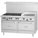 A large stainless steel U.S. Range commercial gas range with 6 burners, a griddle, and storage.