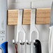 A Mercer knife rack with two knives hanging on it.