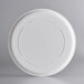 A white plate with a circular rim.