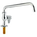 A chrome deck-mounted faucet with a silver lever handle.