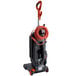 A Hoover HushTone commercial bagged upright vacuum cleaner with a red hose.