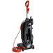 A Hoover commercial bagged upright vacuum cleaner with a red cord.