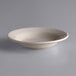 A Libbey Princess White stoneware soup bowl on a gray surface.
