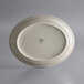 A white Libbey cream white narrow rim oval stoneware platter with a logo on it.