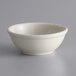 A Libbey Princess White stoneware oatmeal bowl with a rolled edge on a white surface.