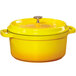 A GET yellow enamel coated cast aluminum dutch oven with a lid.