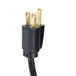 A black power cord with a black electrical plug with gold tips.
