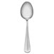A Libbey stainless steel medium weight teaspoon with a white handle on a white background.