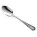 A Libbey stainless steel tablespoon with a silver handle.