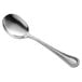 A Libbey McIntosh stainless steel soup spoon with a silver handle and bowl.