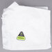 A white plastic bag with a yellow and green triangle and logo.