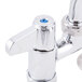 A chrome Equip by T&S deck-mounted faucet with blue lever handles.