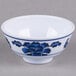 A white Thunder Group melamine bowl with blue flowers.