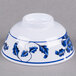 A white bowl with blue flowers and a white design.