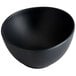 A dark gray irregular round melamine bowl.