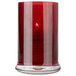 A Sterno red votive candle in a glass holder.