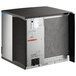 A black and silver Manitowoc air cooled ice machine.