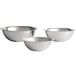 A group of silver Vollrath stainless steel bowls.