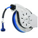 A T&S steel hose reel with blue hose on a metal wheel.