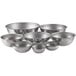 A set of eight stainless steel Vollrath mixing bowls.