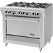 A large stainless steel U.S. Range gas range with six burners and a storage base.