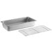 A Choice stainless steel steam table pan with a footed cooling rack on a counter.