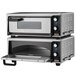 A Waring countertop pizza oven stacking kit with two silver ovens stacked on a counter.