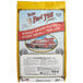 A bag of Bob's Red Mill Organic Gluten-Free Whole Grain Rolled Oats with a picture of a building on a white background.