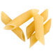A close-up of three pieces of Regal Penne Rigate pasta on a white background.