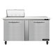 A Continental Refrigerator stainless steel commercial refrigerator with two doors open and a cutting top.