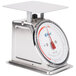 A stainless steel Edlund portion scale with a white dial.