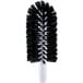 A black and white circular brush with a white handle.