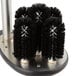 A circular brush holder with black bristles for Noble Products glass washers.